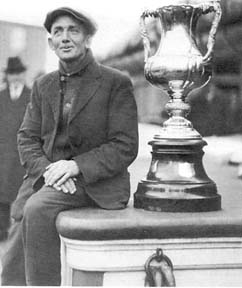 Captain Angus Walters of Lunenburg with the International Fishermen’s Trophy on board Bluenose.