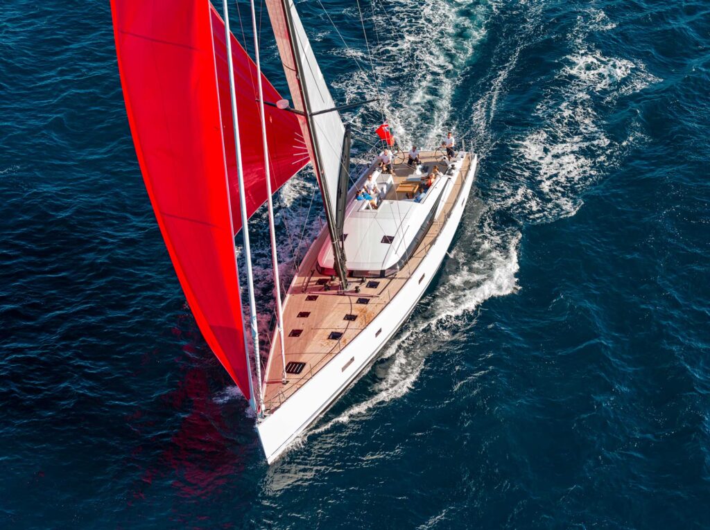 cnb 76 with white hull and red sails