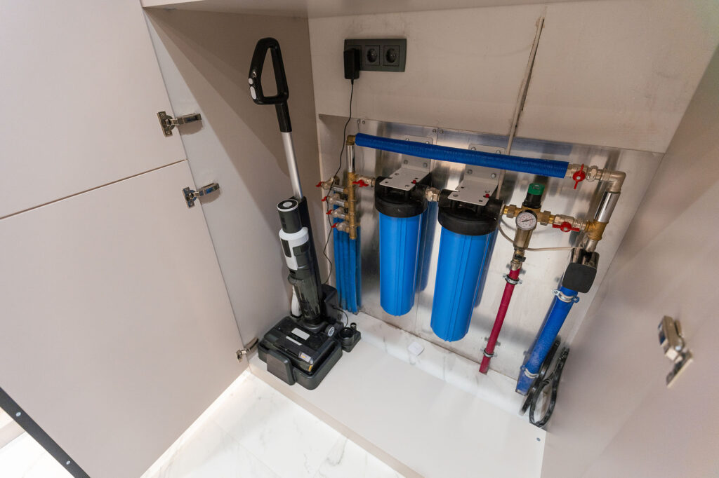 Water filter housing. Drinking Water System. Osmosis water purification filter for home use. healthy lifestyle.