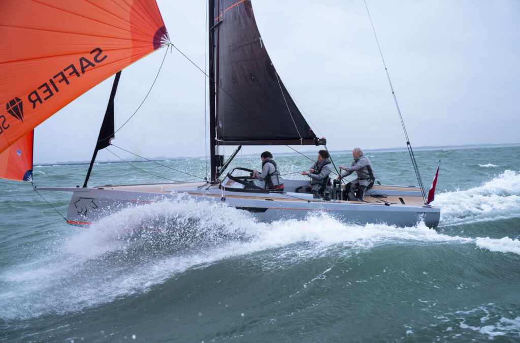 Rough waves crashing into the hull as it sails on